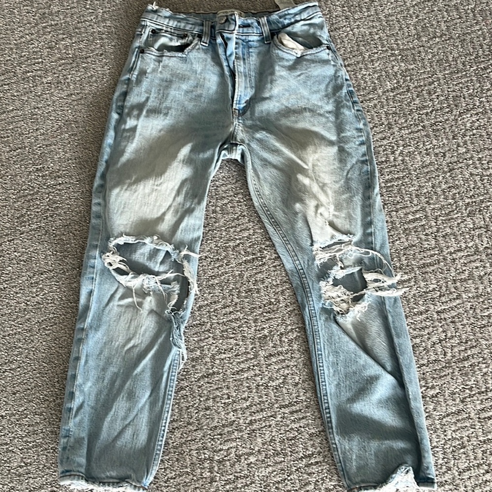 Faded distressed frayed jeans